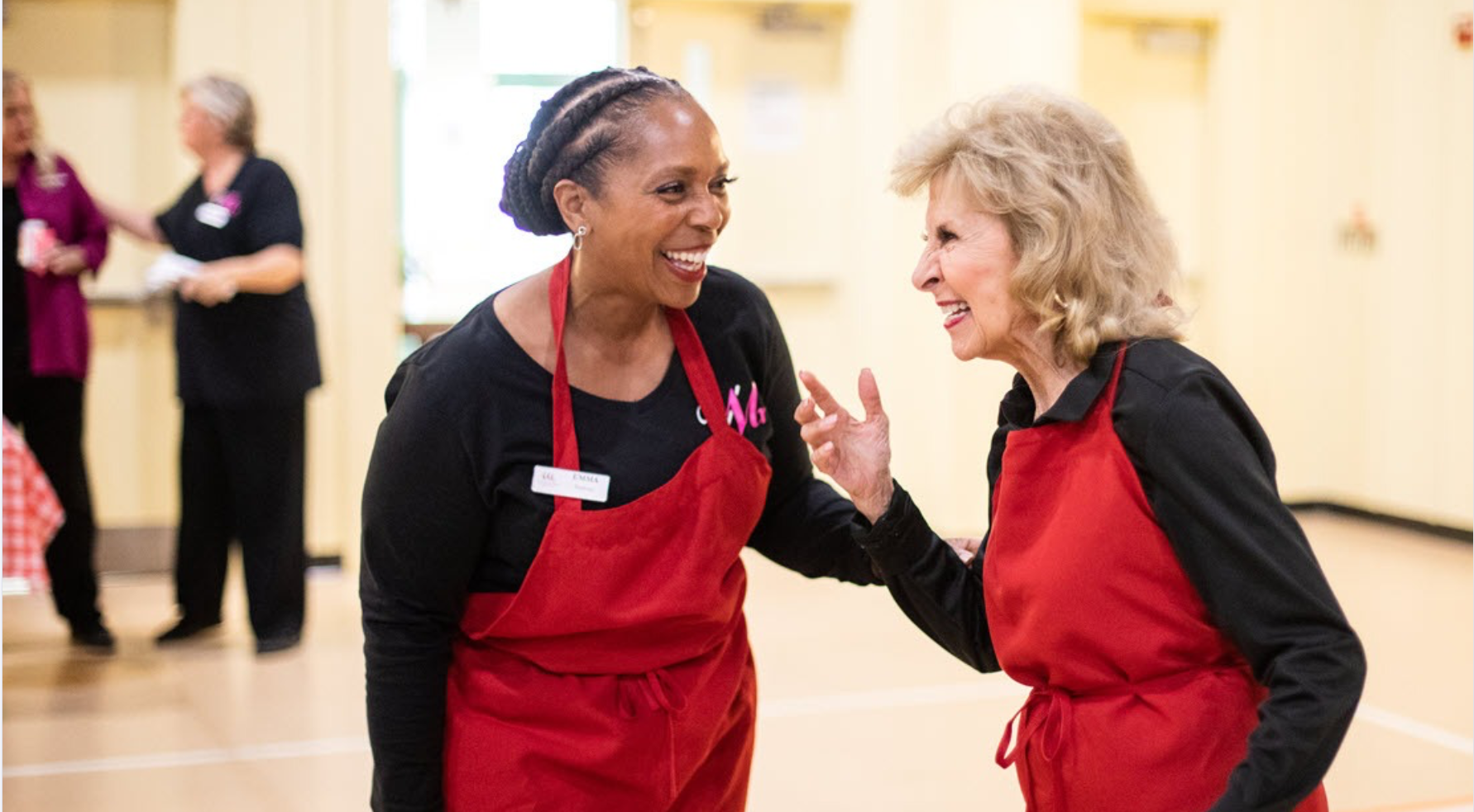 Two Vocal Matrix members sharing a joyful moment